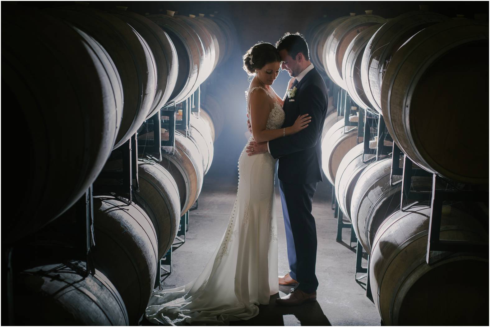 Creative cellar bride and groom portrait