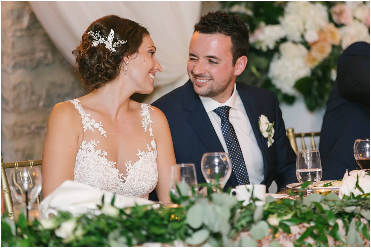Bride and groom react to speeches at Stone Mill wedding