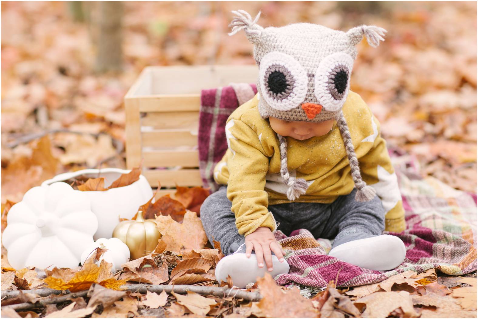 Baby in crochet owl hat during fall mini session